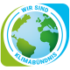 Offizielles Logo des Klimabündnis-Netzwerks mit stilisierter Weltkugel und der Aufschrift Wir sind Klimabündnis