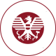 Rundes rot-weißes Emblem mit Adler und Werkzeugen, Kennzeichen für einen österreichischen Meisterbetrieb im Handwerk
