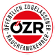Rotes und schwarzes ÖZR-Logo mit der Aufschrift ‚Öffentlich zugelassener Rauchfangkehrer‘ als Qualitäts- und Zulassungszeichen